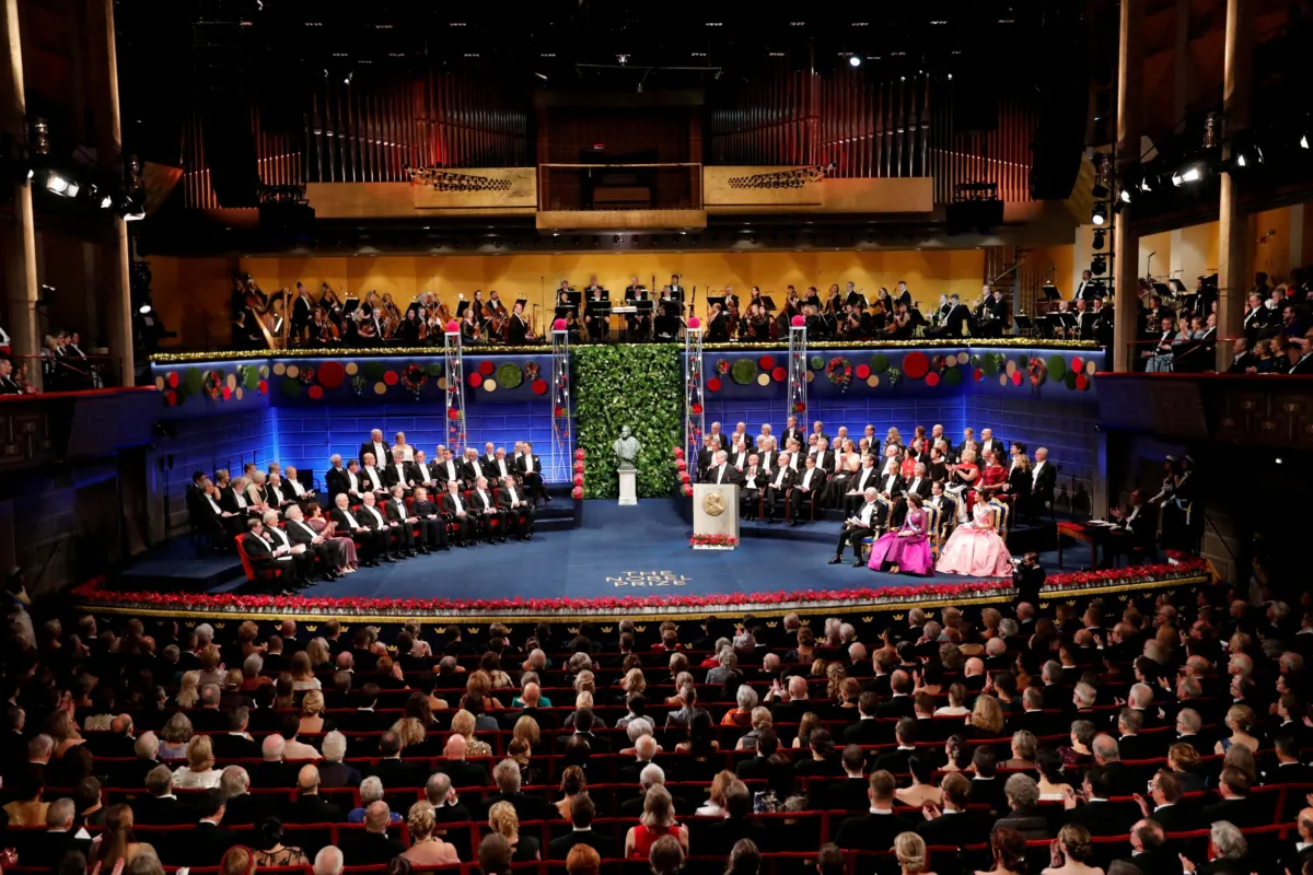 The Nobel laureates and King Carl XVI Gustaf, Queen Silvia, Prince Daniel, Crown Princess Victoria of Sweden attends the Nobel Prize award ceremony at the Concert Hall in Stockholm on Dec. 10, 2022. (TT News Agency/Christine Olsson via Reuters)