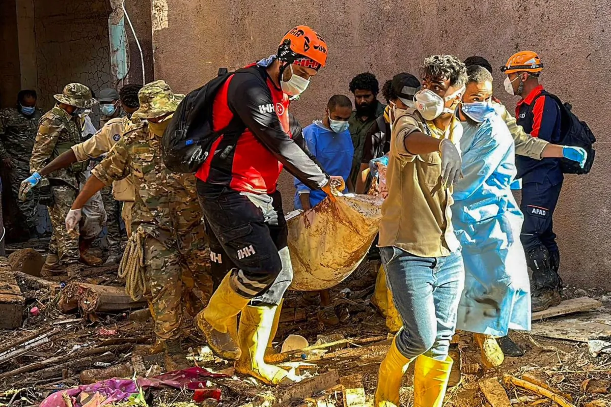 Rescuers retrieve the body of a flooding victim in Derna, Libya, on Sept.13, 2023. (IHH via AP)