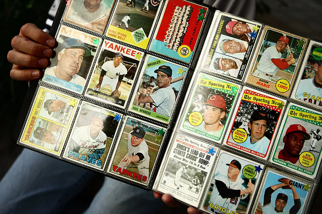 A man sells vintage baseball cards prior to the start of the last game at Yankee Stadium between the Baltimore Orioles and the New York Yankees at Yankee Stadium in the Bronx borough of New York City on Sept. 21, 2008. (Chris McGrath/Getty Images)