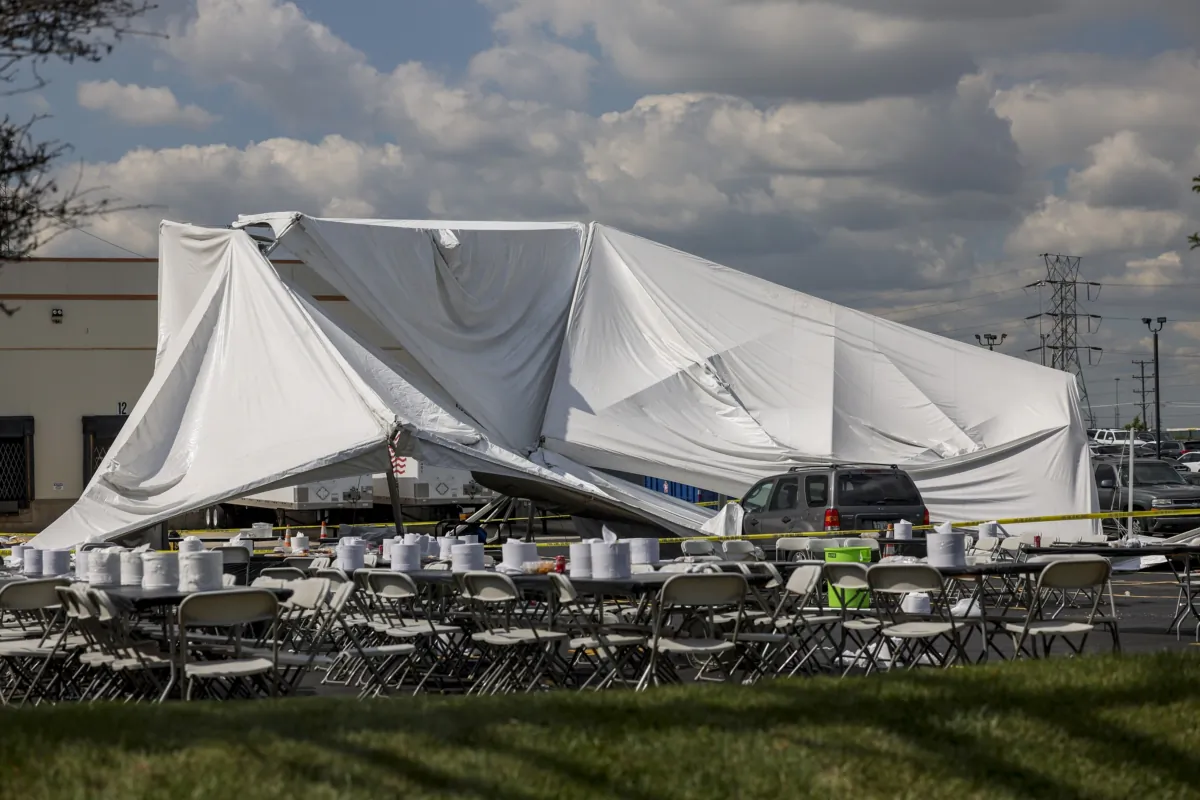 A collapsed tent sits in a parking lot in the 5600 block of West 73rd Street in Bedford Park, Chicago, on Sept. 14, 2023. (Armando L. Sanchez/Chicago Tribune via AP)