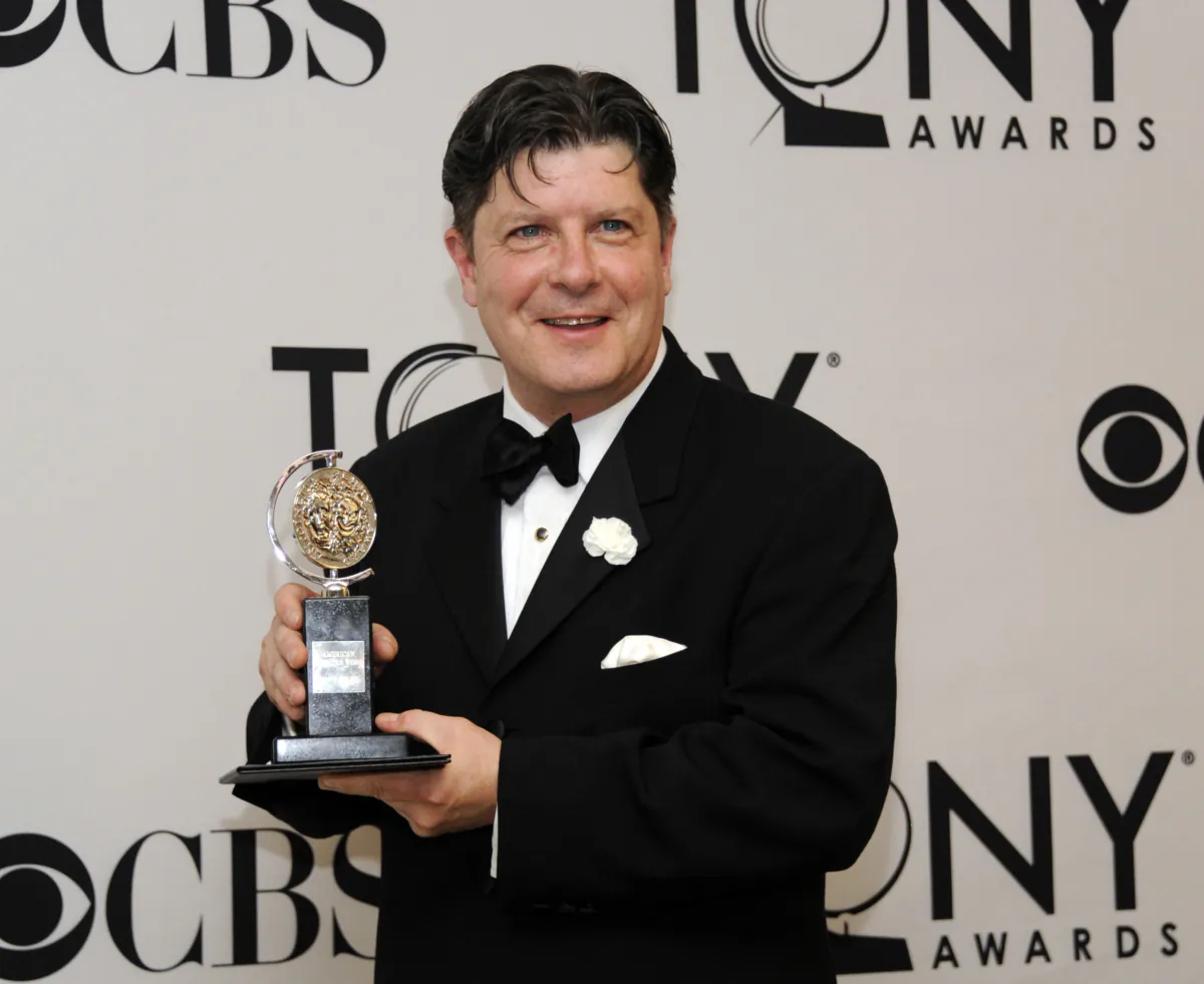 Michael McGrath poses with his award for best performance by an actor in a featured role in a musical at the 66th annual Tony Awards in New York on June 10, 2012. (Evan Agostini/Invision/AP)