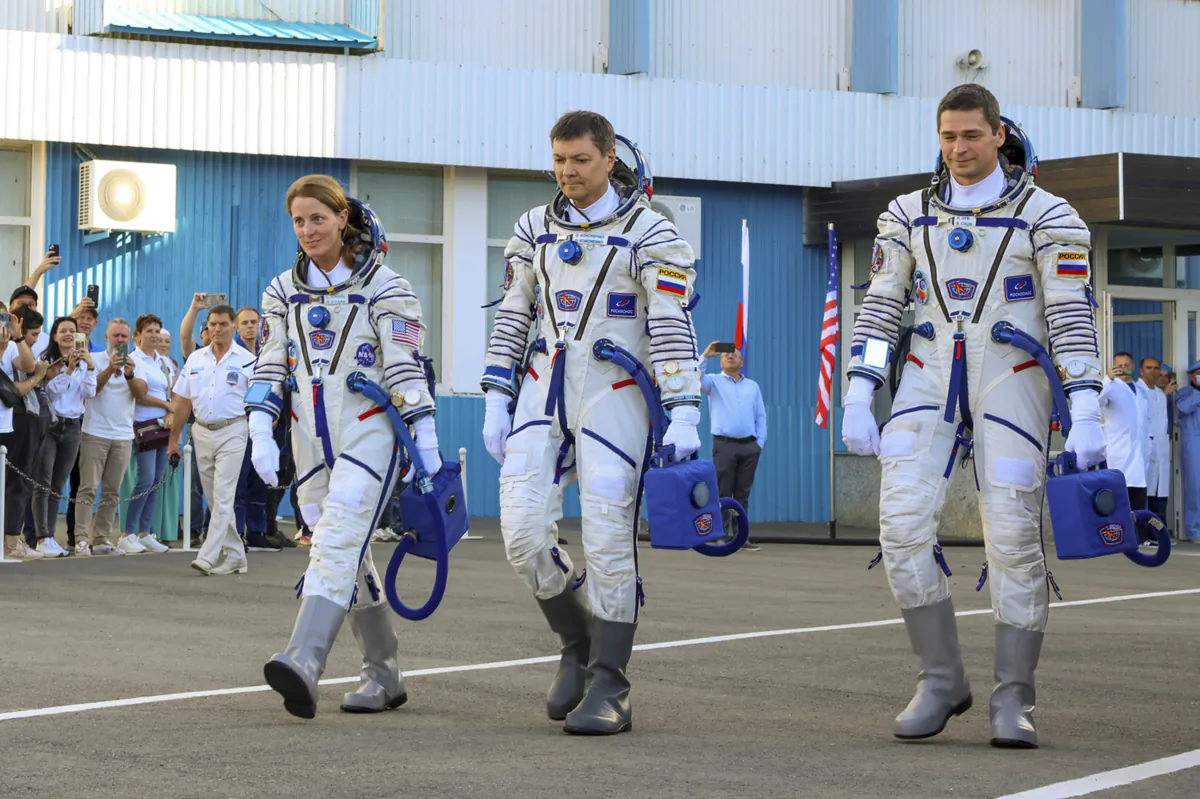 (L-R) NASA astronaut Loral O'Hara, Roscosmos cosmonauts Oleg Kononenko and Nikolai Chub, crew members of the new mission to the International Space Station, ISS, walk prior the launch of Soyuz MS-24 space ship in Russian leased Baikonur cosmodrome in Kazakhstan on Sept. 15, 2023. (Roscosmos space corporation, via AP)