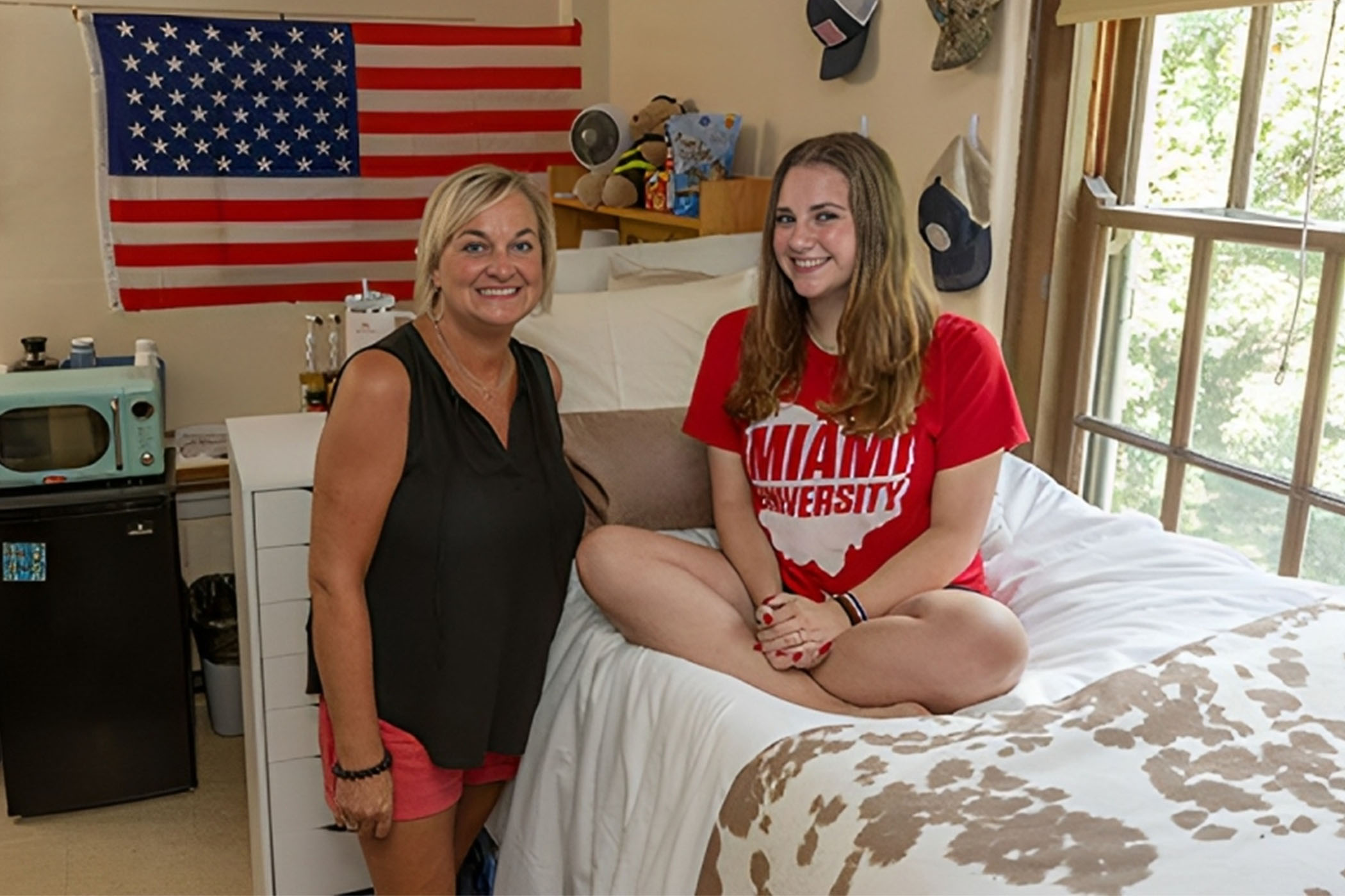Ms. Laura Bowling and her daughter, Ms. Sarah Bowling in the same dorm room 33 years later.