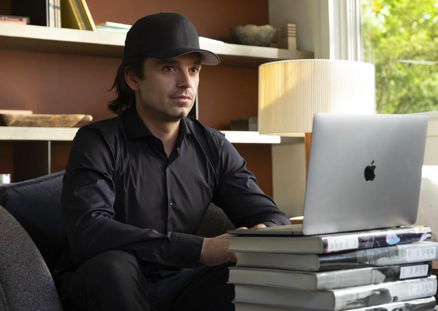 man in black shirt and black hat in DUMB MONEY