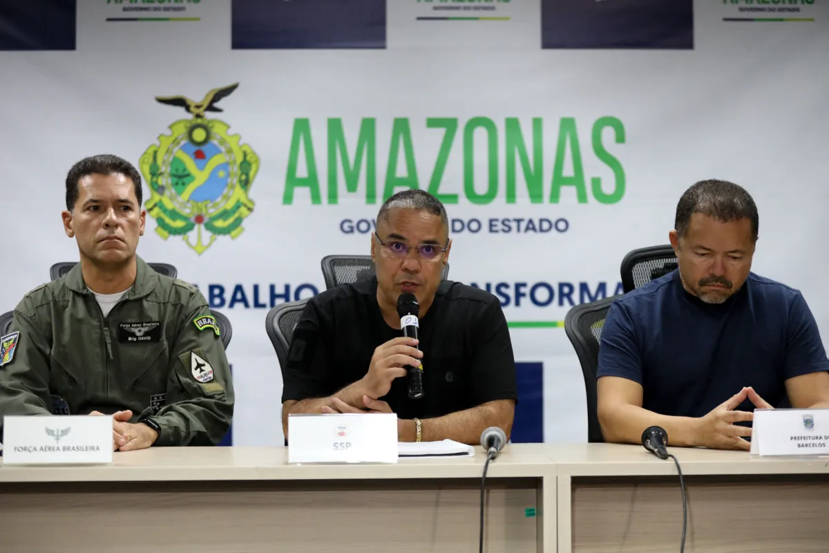 Amazonas State Security Secretary Colonel Vinicius Almeida (C), flanked by the commander of the Seventh Regional Air Command (VII COMAR) brigadier David Almeida (L) and the mayor of Barcelos Edson Mendes, speaks during a press conference in Manaus, Brazil, on Sept. 16, 2023, about the plane crash in which 14 people died during landing at Barcelos airport. (Michael Dantas/AFP via Getty Images)