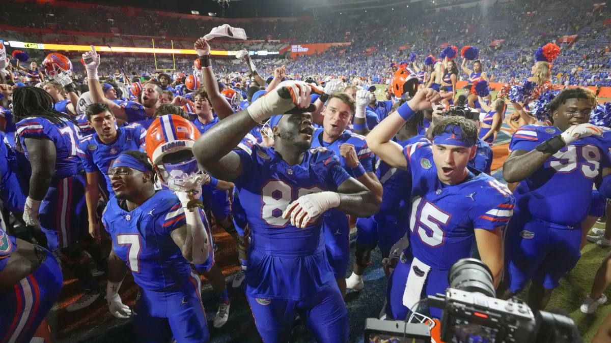 Florida players including Trevor Etienne (7), Caleb Banks (88) and Graham Mertz (15) celebrate after defeating Tennessee in an NCAA college football game in Gainesville, Fla., on Sept. 16, 2023. (John Raoux/AP Photo)