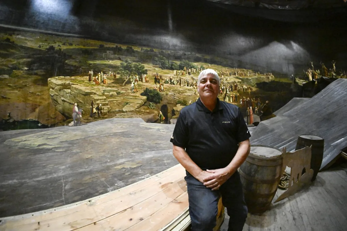 Pierre Blouin sits inside the Cyclorama de Jerusalem, in Ste-Anne-de-Beaupré, Que., on Sept. 6, 2023. (The Canadian Press/Jacques Boissinot)