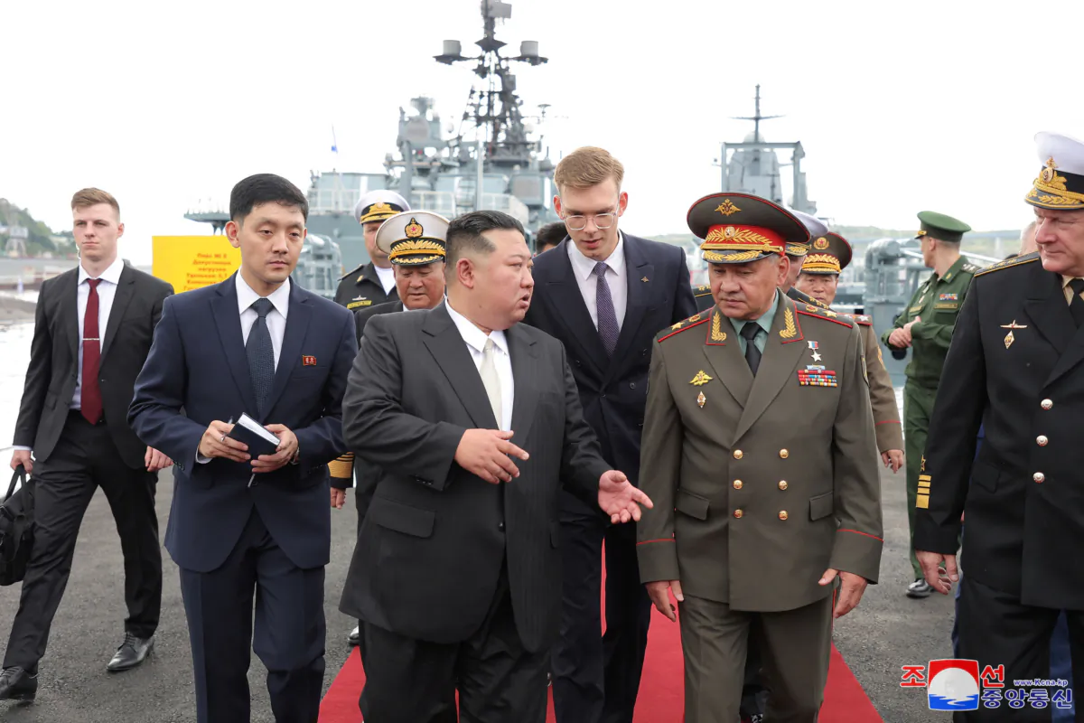 North Korean leader Kim Jong Un walks with Russia's Defense Minister Sergei Shoigu as he visits Vladivostok, Russia, on Sept. 16, 2023. (KCNA via Reuters)