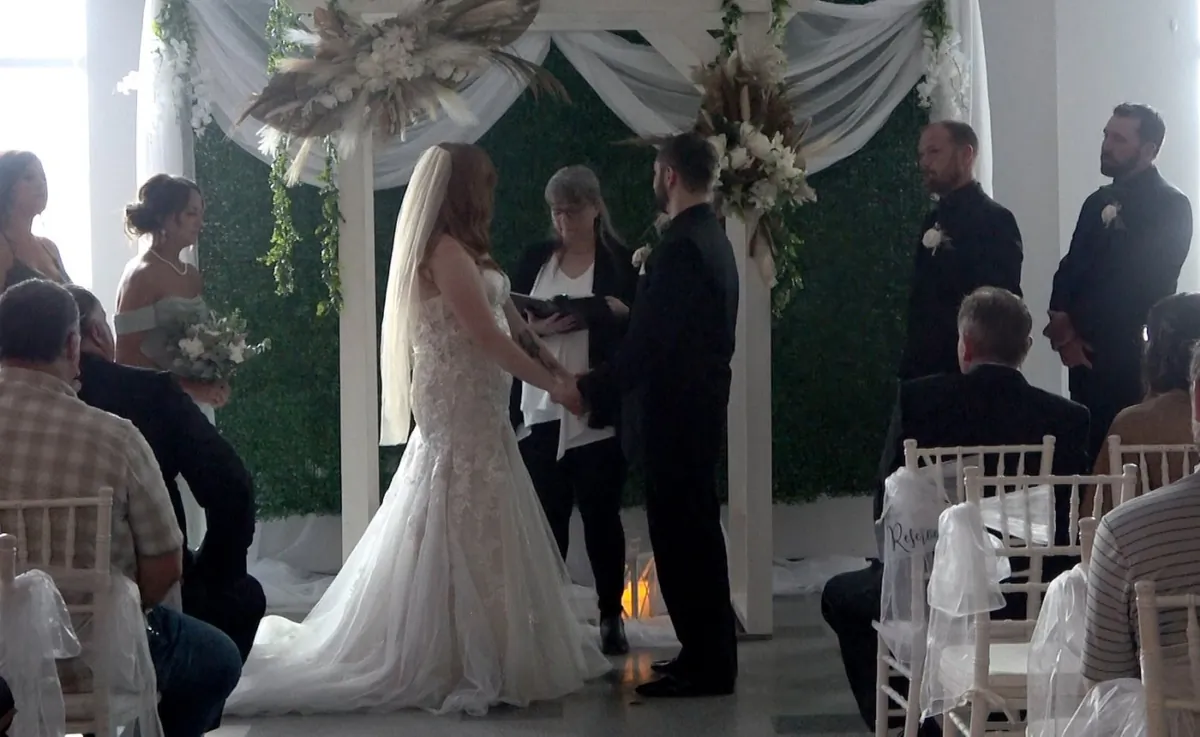 Sarah and Dave Roy are seen during their wedding in a still image made from video shot at the Garcelon Civic Centre in St. Stephen, N.B., on Sept. 16, 2023. (The Canadian Press/Hina Alam)