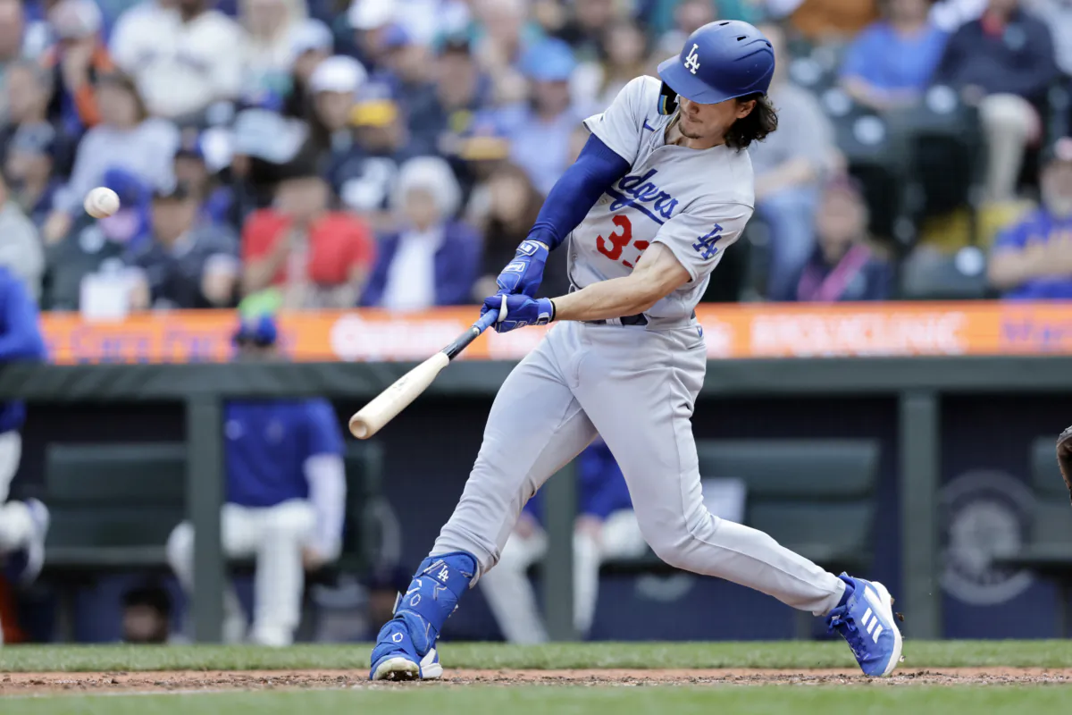 Los Angeles Dodgers' James Outman hits a solo home run off Seattle Mariners relief pitcher Dominic Leone during the eighth inning of a baseball game in Seattle on Sept. 17, 2023. (John Froschauer/AP Photo)