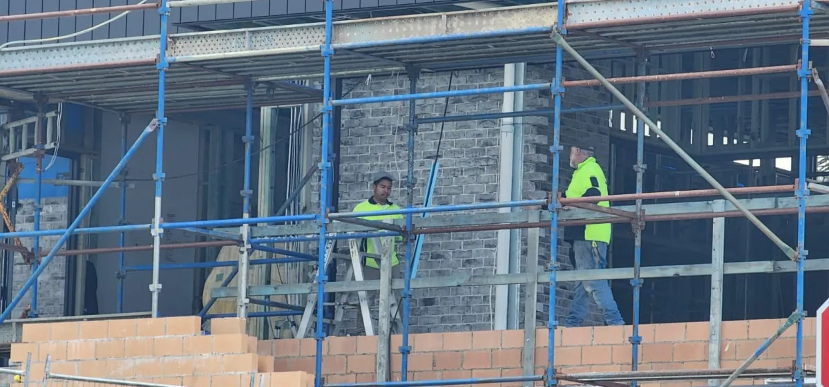 Two men work on a residential house construction in Albany, Western Australia, on Sept. 18, 2023. (Susan Mortimer/The Epoch Times)
