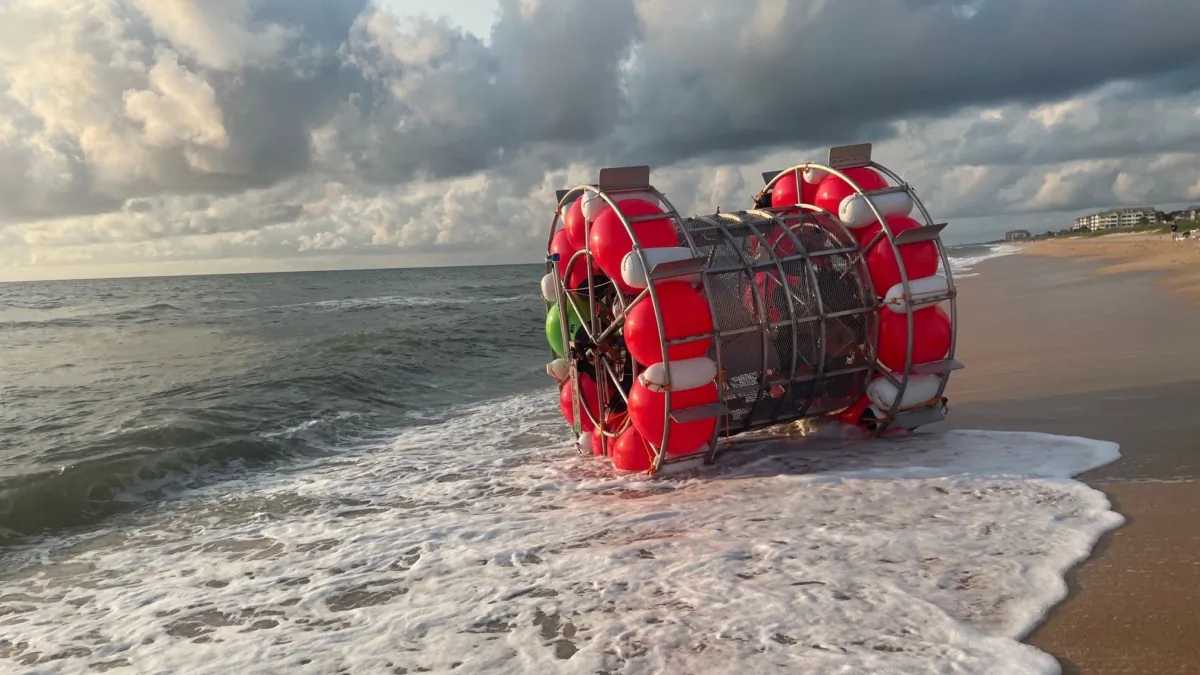 Ray Baluchi's self-propelled vessel that works like a hamster exercise wheel on Flagler Beach, Fla., after his aborted journey to New York in July 2021. (Courtesy Flagler Sheriff's Office)