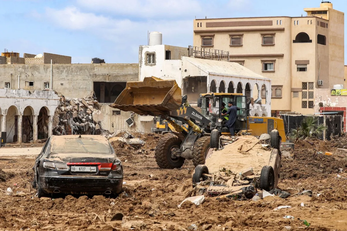 Following deadly flash floods, an excavator clears debris in Libya's eastern city of Derna on Sept. 18, 2023. (Mahmud Turkia/AFP via Getty Images)