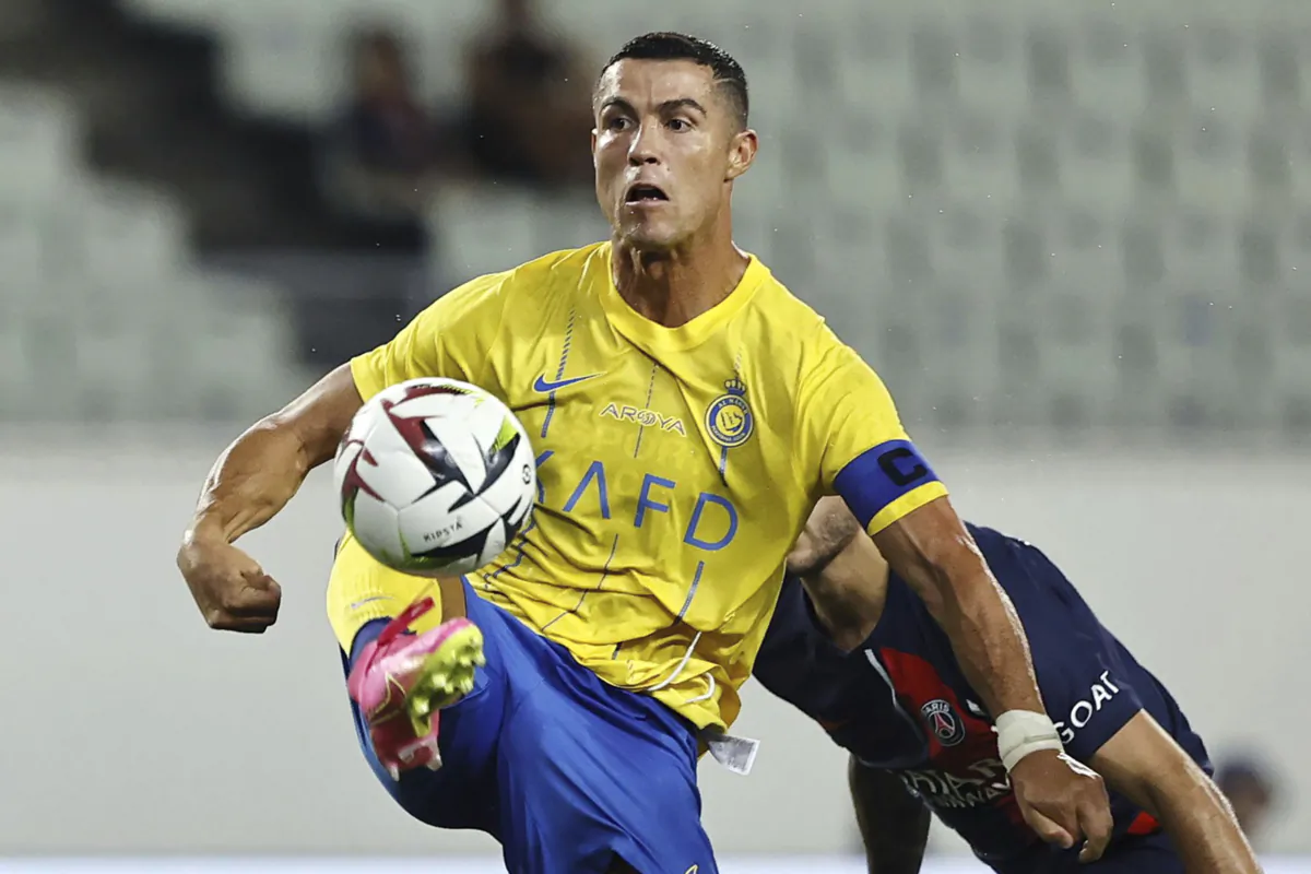 Al Nassr's Cristiano Ronaldo controls the ball during a friendly soccer match against Paris Saint-Germain in Osaka, western Japan, on July 25, 2023. (Kyodo News via AP)