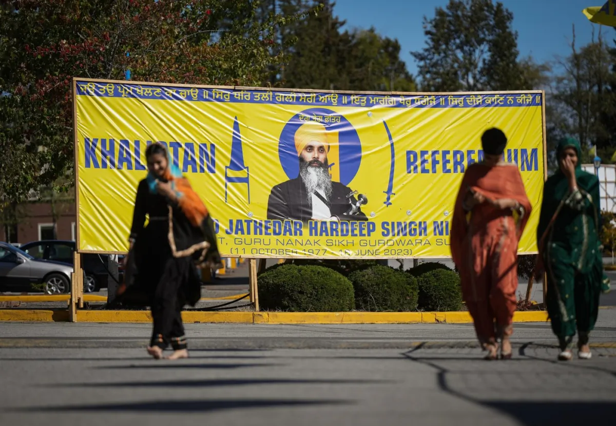 A photograph of late temple president Hardeep Singh Nijjar is seen on a banner outside the Guru Nanak Sikh Gurdwara, in Surrey, B.C., on Sept. 18, 2023. (The Canadian Press/Darryl Dyck)