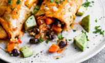 This easy Vegetarian Enchiladas recipe has the best flavorful veggie filling from sweet potatoes, black beans, bell pepper and brown rice. It’s a hearty, healthy dinner your whole family will love!