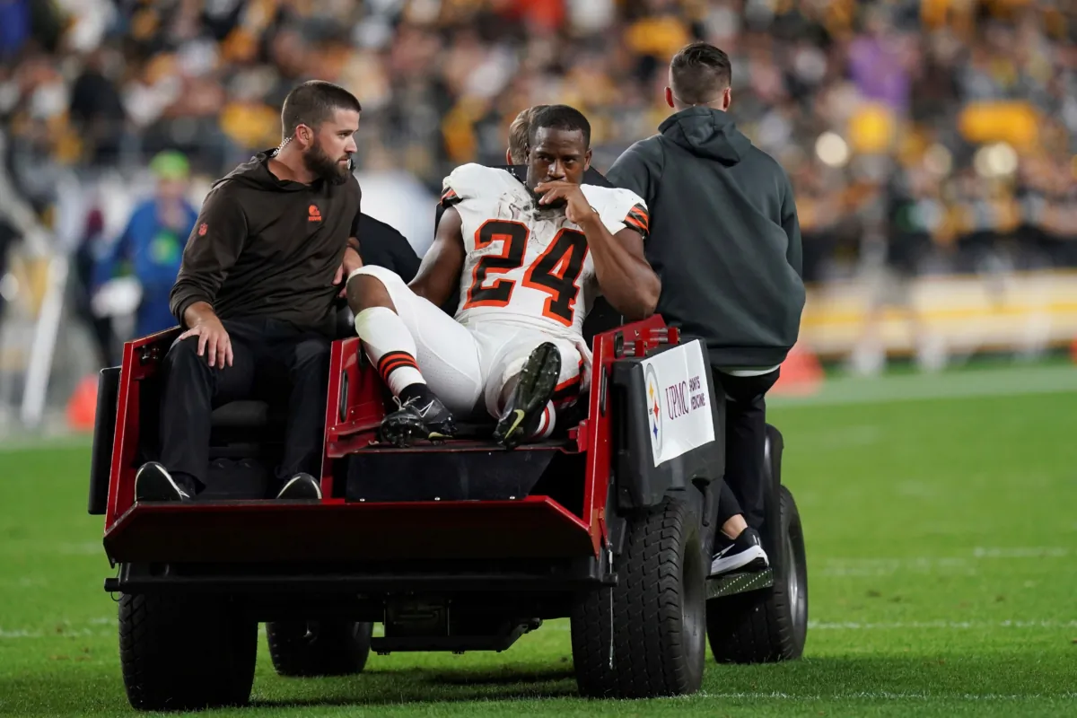 Cleveland Browns running back Nick Chubb is cared off the field with an injury during the first half of an NFL football game against the Pittsburgh Steelers in Pittsburgh on Sept. 18, 2023. (Matt Freed/AP Photo)