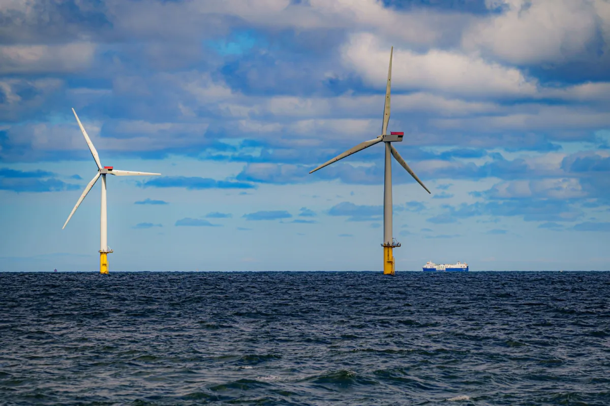 Photo of a ship passing wind turbines at RWE's Gwynt y Mor on July 26, 2022. (Ben Birchall/PA Wire)