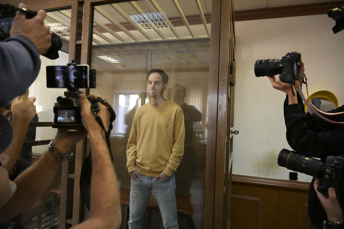Wall Street Journal reporter Evan Gershkovich stands in a glass cage in a courtroom at the Moscow City Court in Moscow on Sept. 19, 2023. (Dmitry Serebryakov/AP Photo)