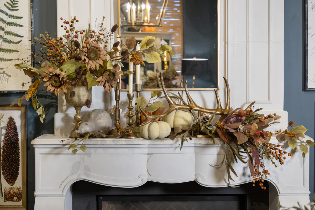 This opulent fall mantel arrangement boasts a curated feel and asymmetrical design. (Handout/TNS)