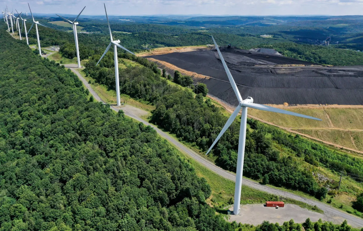 Wind turbines from the Roth Rock wind farm at the Backbone Mountain, next to the Mettiki Coal processing plant, in Oakland, Md., on Aug. 23, 2022. (Chip Somodevilla/Getty Images)