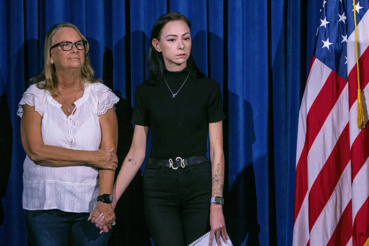 Crystal Probst, (L), and her daughter, Taylor Probst, family members of Andreas Rene Probst, a cyclist who was intentionally struck in a series of hit-and-run crashes, wait to speak at a news conference in Las Vegas, on Sept. 19, 2023. (Ty ONeil/AP Photo)