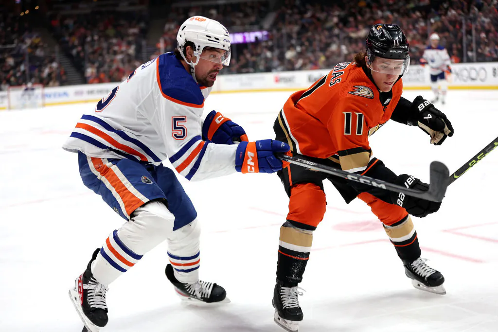 Trevor Zegras (11) of the Anaheim Ducks defends against Cody Ceci (5) of the Edmonton Oilers during the first period of a game at Honda Center in Anaheim, Calif., on April 5, 2023. (Sean M. Haffey/Getty Images)