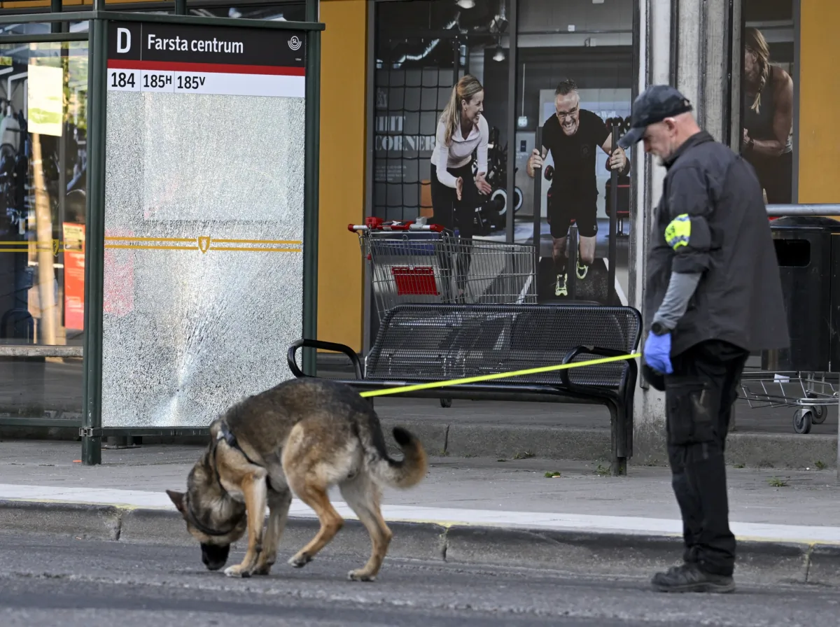 Police at the scene after a shooting incident in Farsta, southern Stockholm, on June 10, 2023. (Anders Wiklund/TT News Agency via AP)