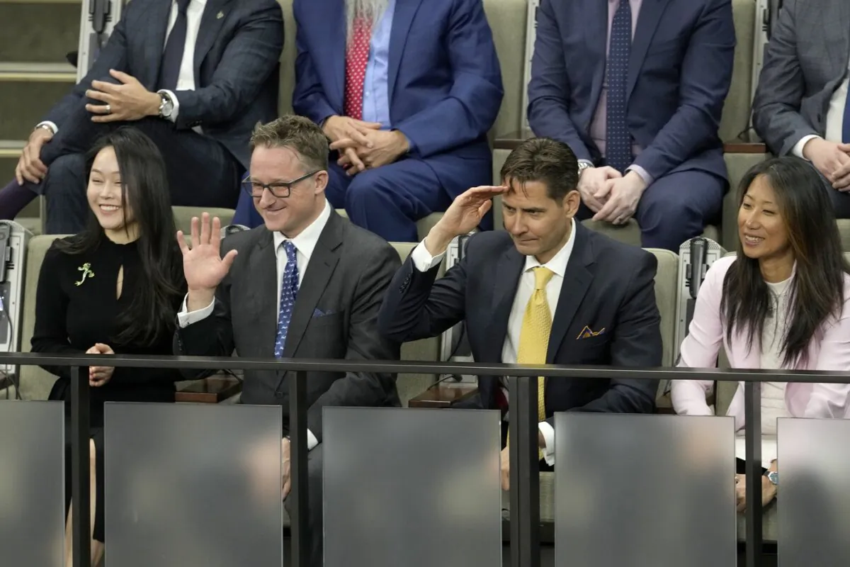Michael Spavor (2nd L) and Michael Kovrig (2nd R) receive a standing ovation in the House of Commons prior to U.S. President Joe Biden’s address of Parliament, in Ottawa on March 24, 2023. (The Canadian Press/Adrian Wyld)