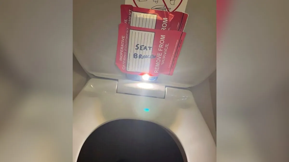 An iPhone is taped to the back of a toilet seat on an American Airlines flight from Charlotte, N.C., to Boston, on Sept. 2, 2023. (Lewis & Llewellyn LLP via AP)
