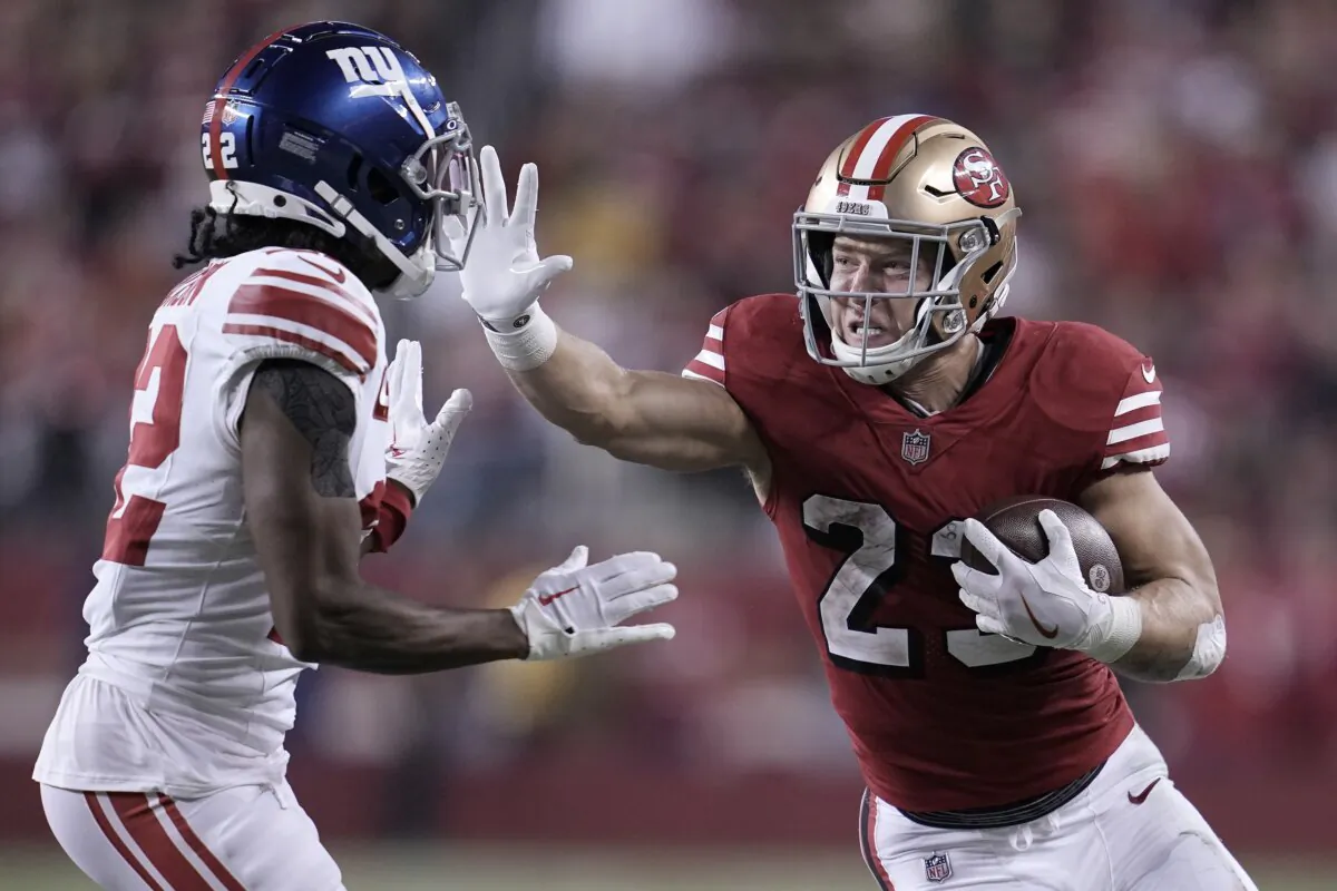 San Francisco 49ers running back Christian McCaffrey (R) runs against New York Giants cornerback Adoree' Jackson during the second half of an NFL football game in Santa Clara, Calif., on Sept. 21, 2023. (Godofredo A. Vásquez/AP Photo)