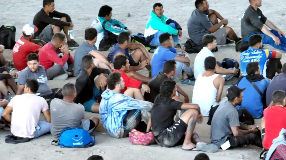 A group of illegal immigrants wait to be processed in Eagles Pass, on Sept. 21, 2023. (CNN/Screenshot via NTD)