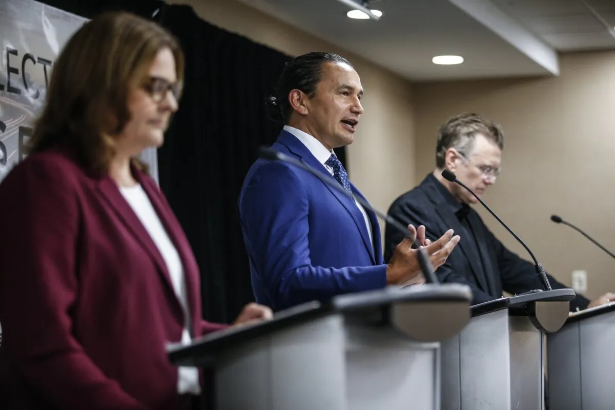 (L-R) Manitoba provincial party leaders: Heather Stefanson (PC), opposition leader Wab Kinew (NDP) and Dougald Lamont (Liberal) speak at the Party Leaders Forum–Growing the Economy in Winnipeg on Sept. 12, 2023. (The Canadian Press/John Woods)