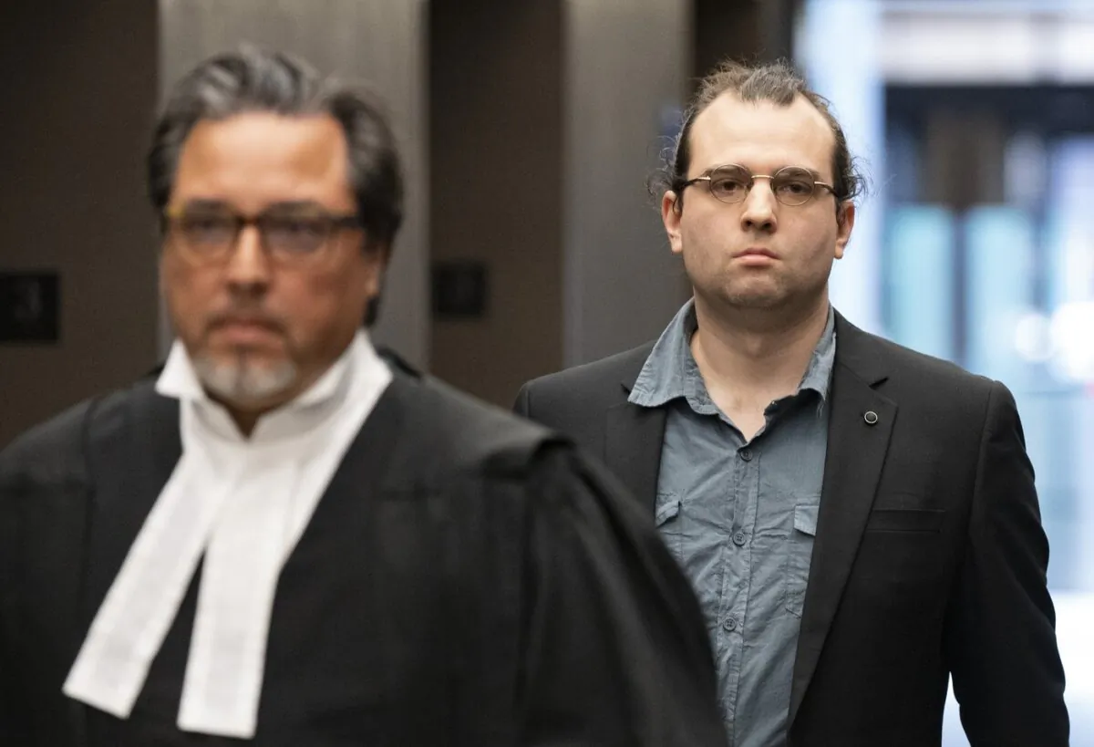 Gabriel Sohier Chaput follows his lawyer as he arrives for sentencing in Montreal, on July 12, 2023. (The Canadian Press/Christinne Muschi)