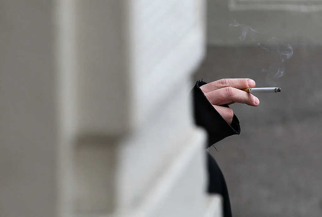 A smoker holds a cigarette in a file photo. (Justin Sullivan/Getty Images)