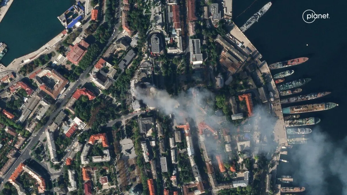 A satellite image shows smoke billowing from a Russian Black Sea Navy HQ after a missile strike in Sevastopol, Crimea, on Sept. 22, 2023. (Planet Labs PBC/Handout via Reuters)