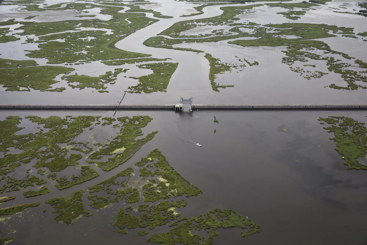 The $1.1 billion Lake Borgne Surge Barrier stands near the confluence of and across the Gulf Intracoastal Waterway and the Mississippi River Gulf Outlet in New Orleans, Louisiana, on Aug. 23, 2019. The massive structure was built by the Army Corps of Engineers along with other reinforcements to defend the city of New Orleans against future hurricanes and storms. (Drew Angerer/Getty Images)