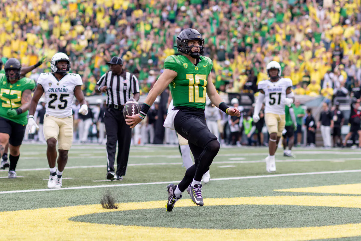 Quarterback Bo Nix (10) of the Oregon Ducks runs for a touchdown against the Colorado Buffaloes during the first half at Autzen Stadium in Eugene, Oregon, on Sept. 23, 2023. (Tom Hauck/Getty Images)
