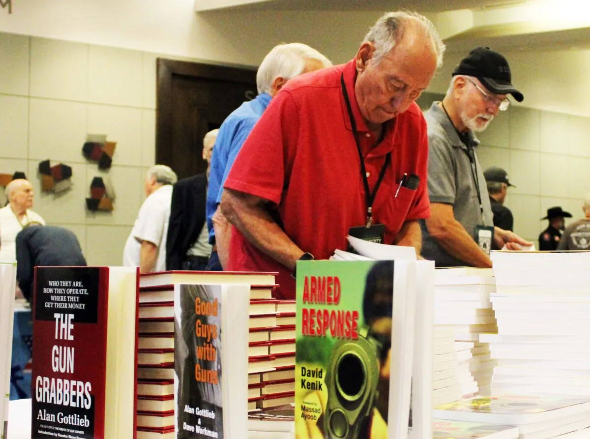 Attendees of the 38th Annual Gun Rights Policy Conferene check out merchandise available at the event on Sept. 23, 2023. (Michael Clements/The Epoch Times)
