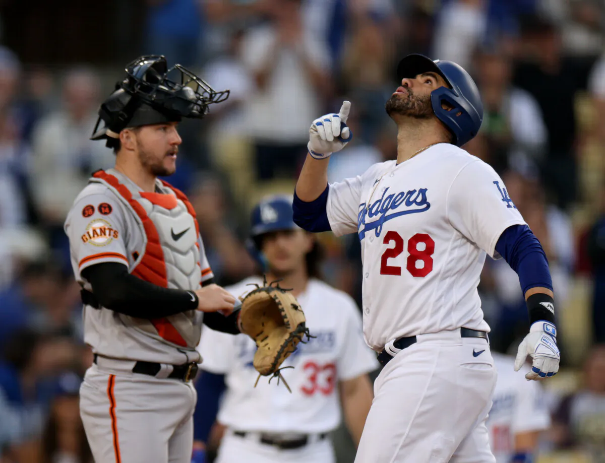 J.D. Martinez (28) of the Los Angeles Dodgers celebrates his solo home run in front of Patrick Bailey (14) of the San Francisco Giants, to take a 1-0 lead, during the first inning at Dodger Stadium in Los Angeles on Sept. 23, 2023. (Harry How/Getty Images)