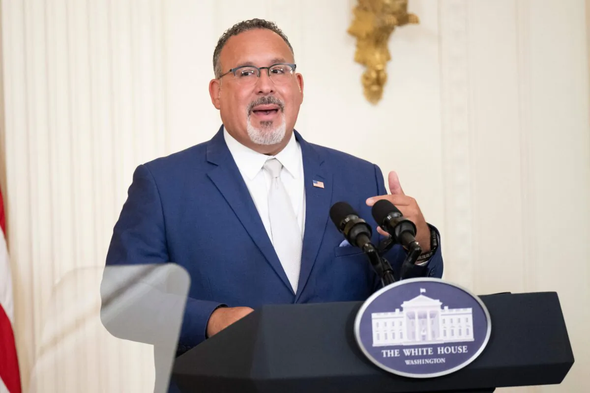 U.S. Education Secretary Miguel Cardona speaks during a back-to-school K-12 Cybersecurity Summit in the East Room of the White House in Washington on Aug. 8, 2023. (Brendan Smialowski/AFP via Getty Images)