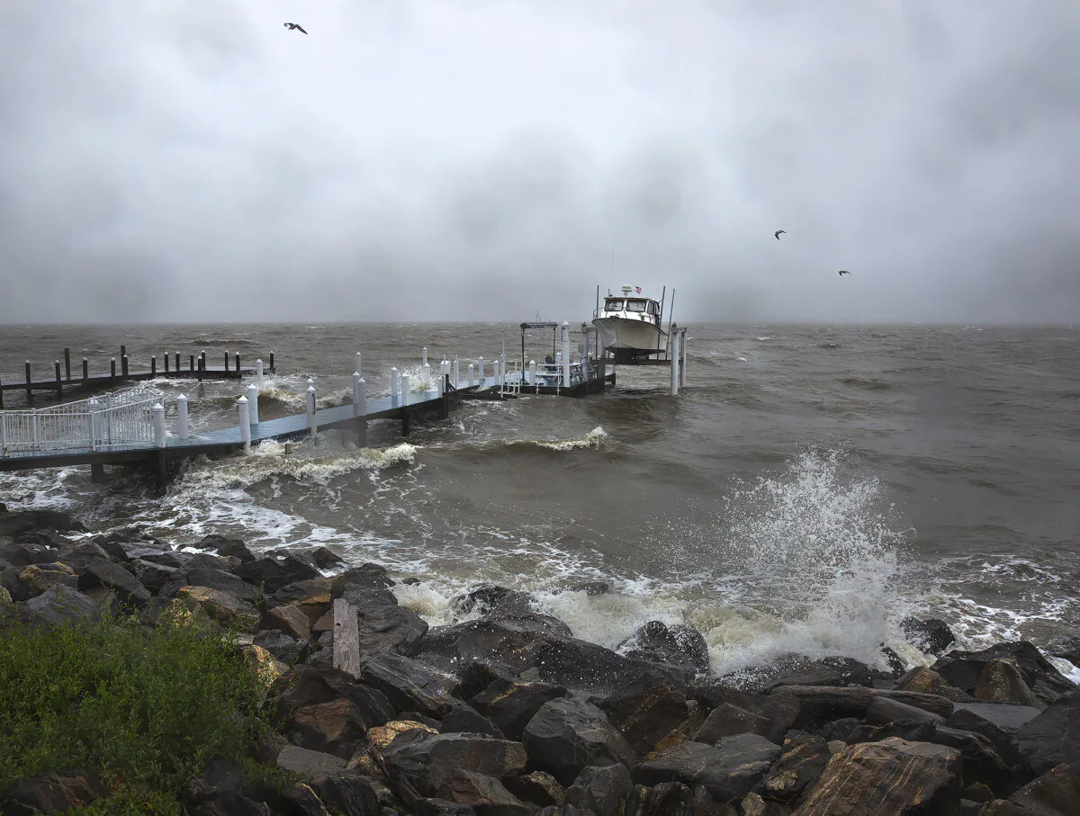 Waves generated by Tropical Storm Ophelia crash up on the banks of the Potomac River along Irving Avenue in the town of Colonial Beach in Westmoreland County, Va., on Sept. 23, 2023. (Peter Cihelka/The Free Lance-Star via AP)
