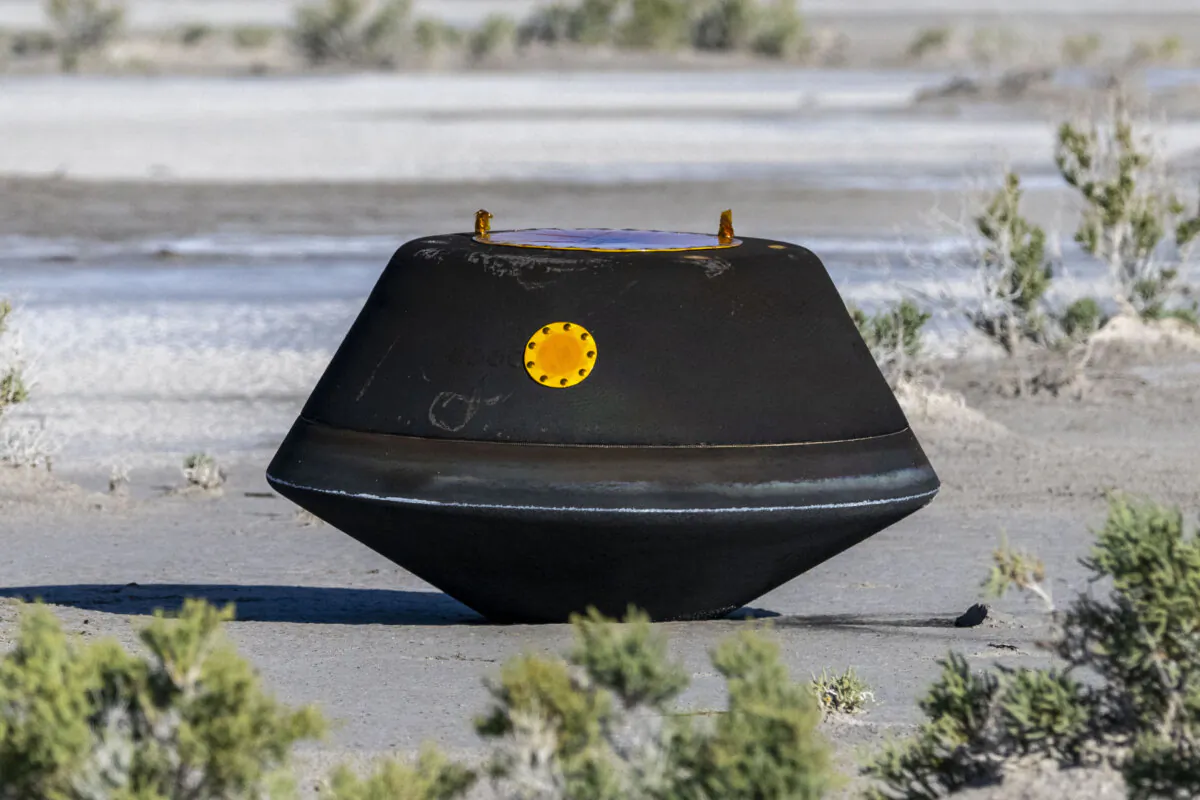 The sample return capsule from NASA's OSIRIS-REx mission shortly after touching down in the desert at the Department of Defense's Utah Test and Training Range in Dugway on Sept. 24, 2023. (Keegan Barber/NASA via Getty Images)