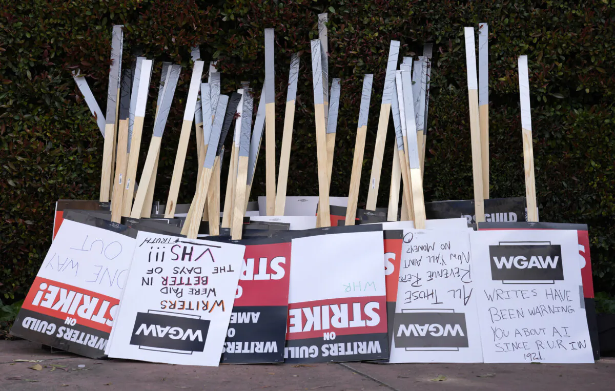 Placards are gathered together at the close of a picket by members of The Writers Guild of America outside Walt Disney Studios in Burbank, Calif., on May 2, 2023. (AP Photo/Chris Pizzello, File)