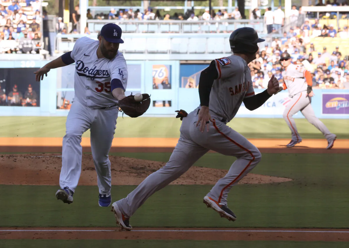 Lance Lynn (35) of the Los Angeles Dodgers catches a pop up of Thairo Estrada (39) of the San Francisco Giants for the third out of the third inning behind Mike Yastrzemski (5) at Dodger Stadium in Los Angeles on September 24, 2023. (Harry How/Getty Images)