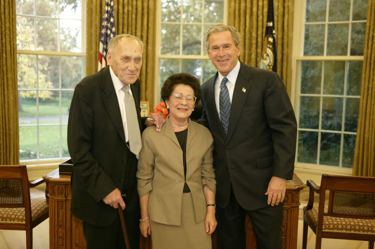In this handout image provided by the White House, President George W. Bush (R) welcomes Professor Leszek Kolakowski (L) and his wife, Tamara, of Oxford, England, in the Oval Office on Nov. 5, 2003. Mr. Kolakowski is the 2003 recipient of the John W. Kluge Prize in Human Sciences. The international honor is awarded by the Library of Congress for lifetime achievement in the humanistic and social sciences. A philosopher, historian and essayist, Professor Kolakowski has written more than 30 books and hundreds of articles on the history of philosophy and the philosophy of religion. (Paul Morse/White House via Getty Images)