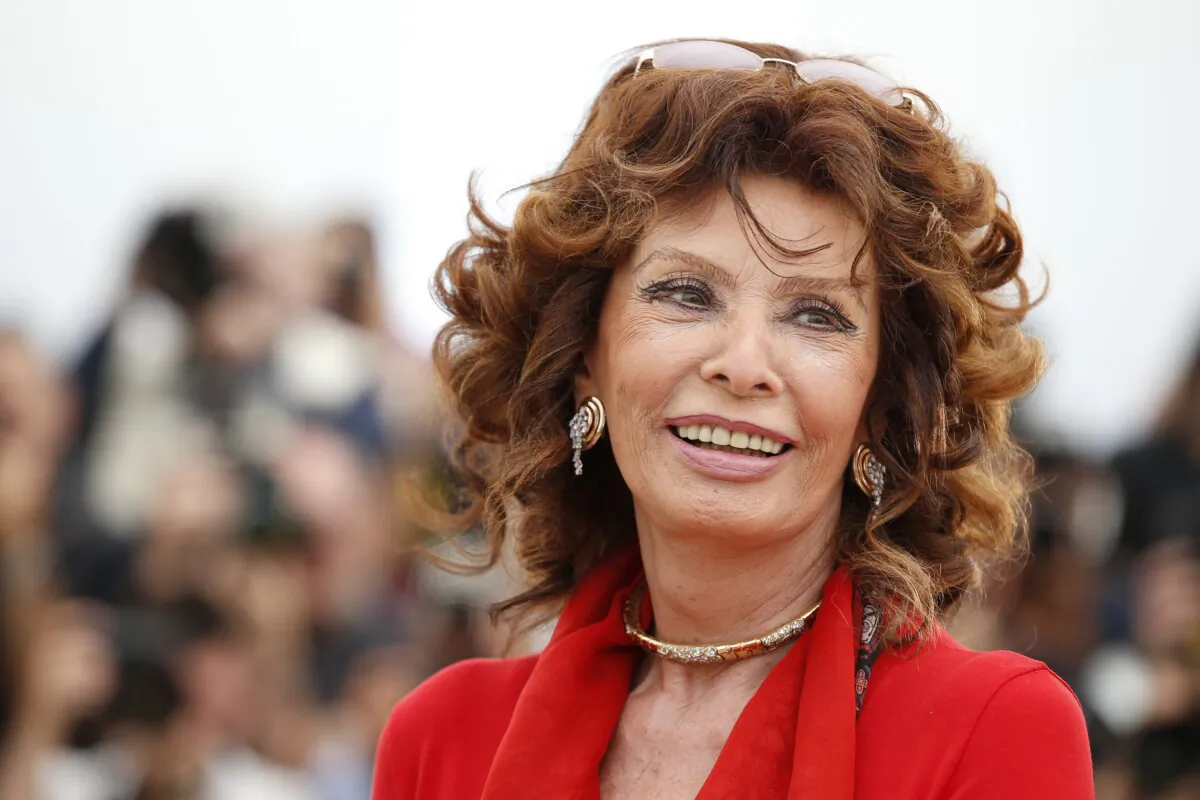 Italian actress Sophia Loren smiles during a photo call for "Human Voice," (Voce Umana) at the 67th international film festival in Cannes, southern France, on May 21, 2014. (Alastair Grant/AP Photo)