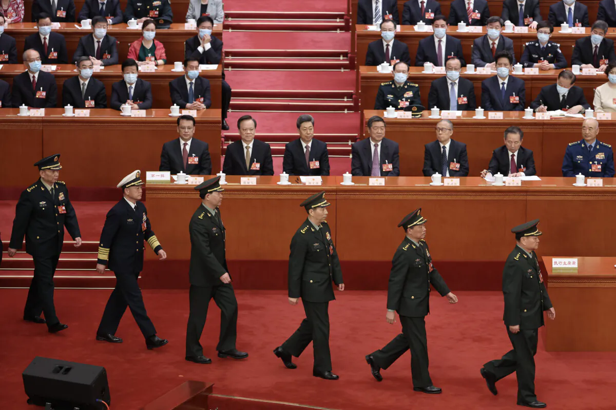 Vice chairman of the Central Military Commission of the People's Republic of China Zhang Youxia and He Weidong (front), swears an oath with members of the Central Military Commission after they were appointed during the fourth plenary session of China's rubber-stamp legislature, the National People's Congress, in Beijing on March 11, 2024. (Lintao Zhang/Getty Images)