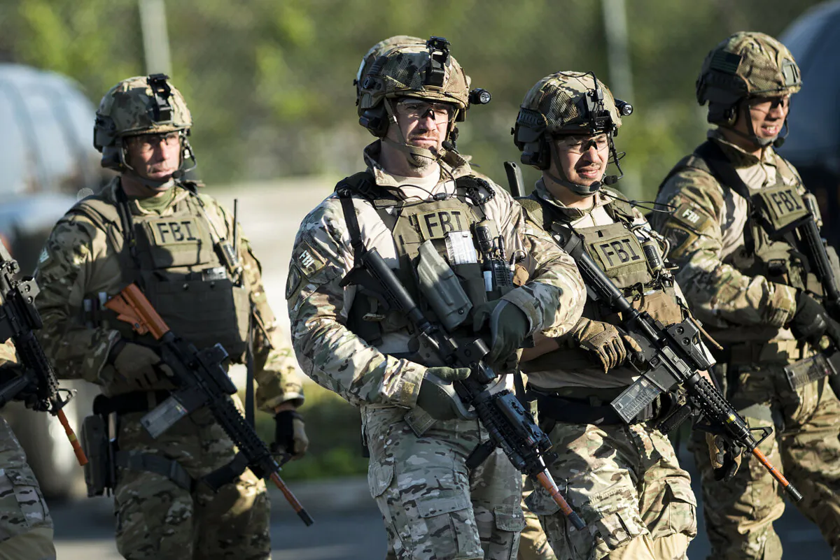 Members of a Federal Bureau of Investigation SWAT team are seen as they walk to enter a mall during an FBI field training exercise at the Landmark Mall May 2, 2014 in Alexandria, Virginia. (Brendan Smialowski/AFP via Getty Images)