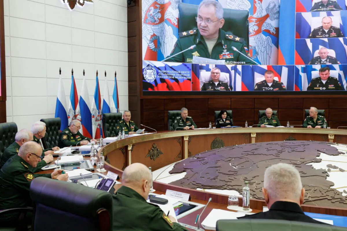 Russian Defense Minister Sergei Shoigu chairs a meeting with the leadership of the Armed Forces as Russian fleet commanders are seen on a screen via video link in Moscow in a picture released on Sept. 26, 2023. (Russian Defense Ministry/Handout via Reuters)
